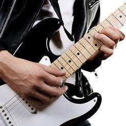 como tocar mejor la guitarra